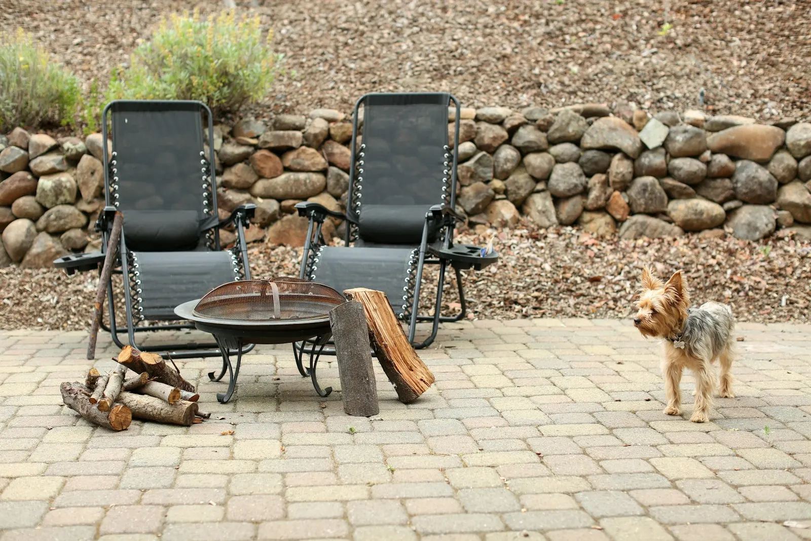 Brick patio with seating around a fire pit